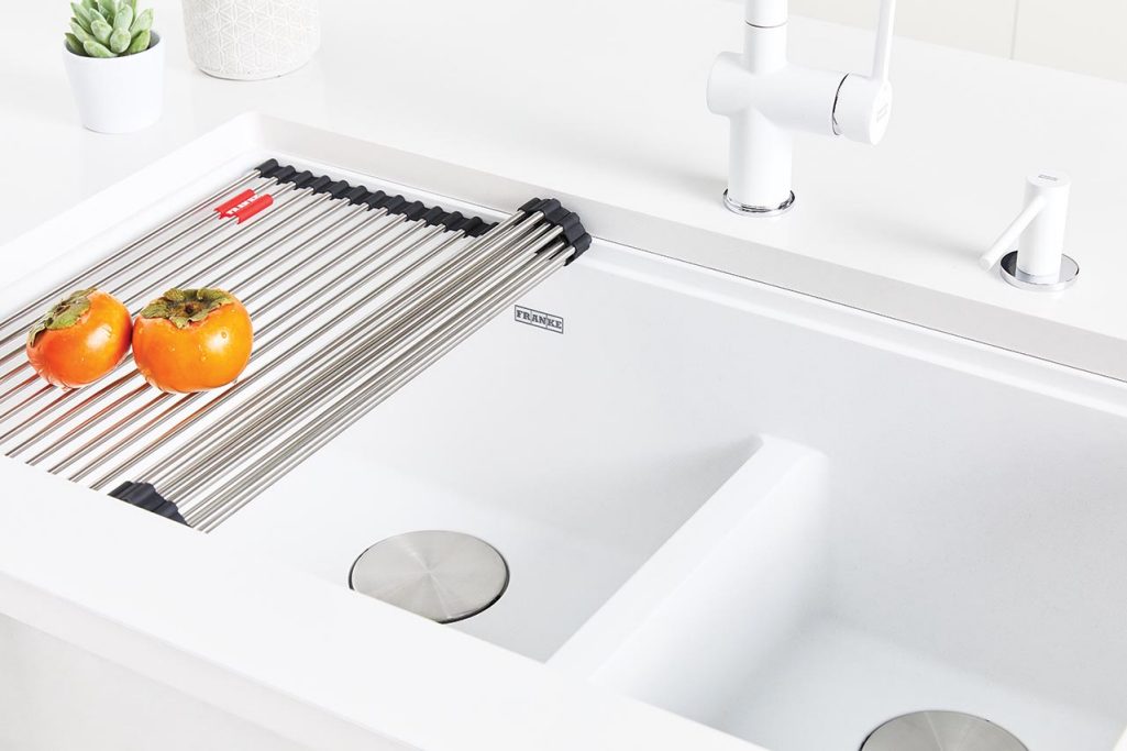 Close up view of the low divide in a Franke Maris polar white kitchen sink