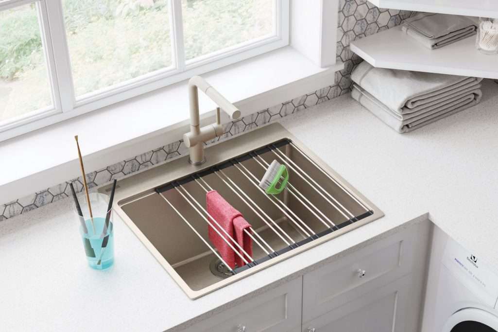 beige granite laundry room sink with drying rack
