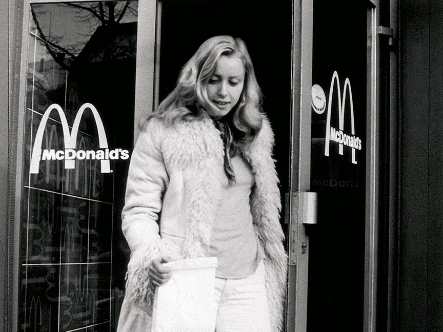 Person exiting a McDonalds restaurant 1972