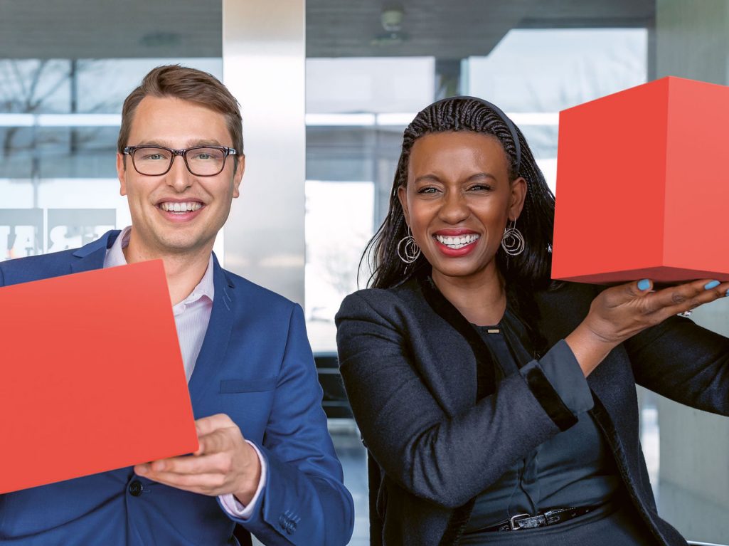 Career represented by two persons holding up red cubes