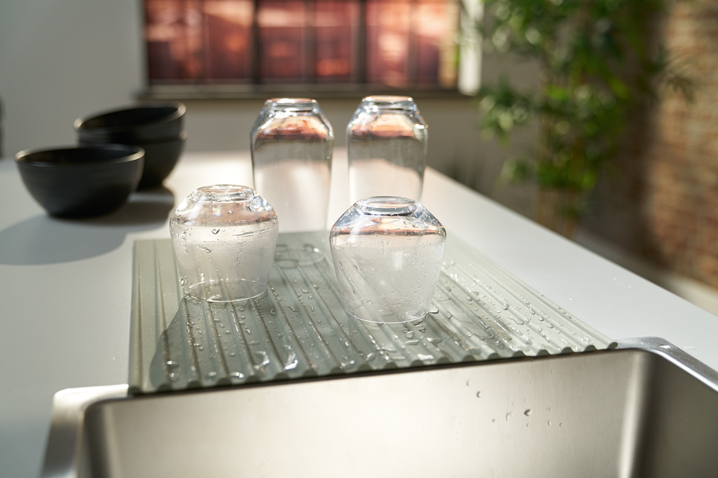 Glasses left to dry on a Franke silicone matte
