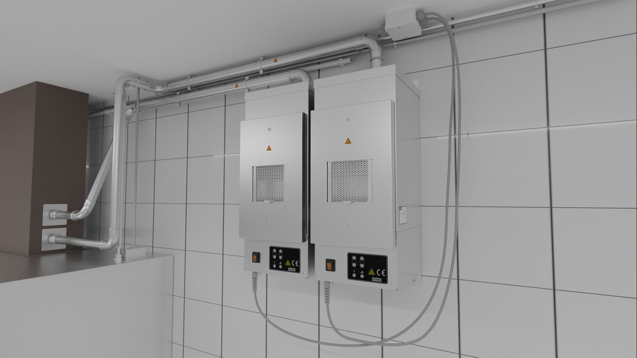 A pair of wall-mounted Franke EcoVent units with conduits providing treated air an adjacent exhaust hood 