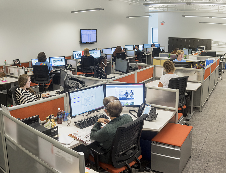 A roomful of Franke customer service agents handle inquiry calls