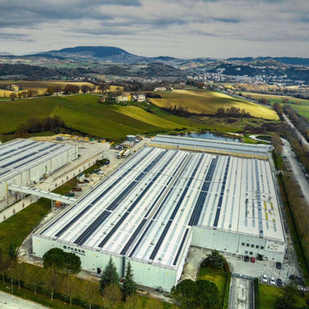 areal view of solar panels on a factory roof